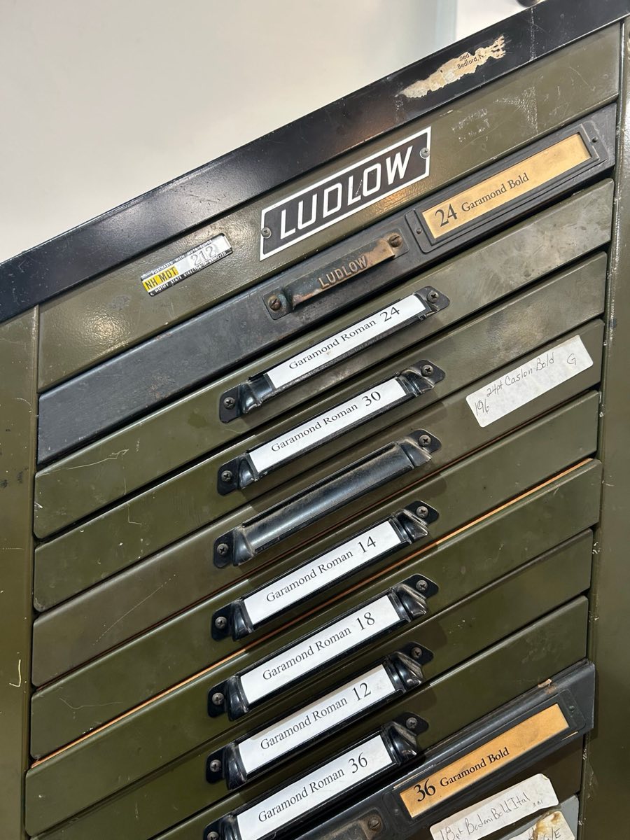 Cabinet of Ludlow type matrices, one labeled drawer per typeface and size